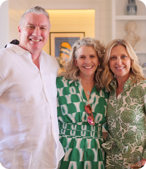 Event - Photo of three people, two women in green and one man in white.